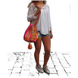 Wayuu Luxury Holiday shoulder bag beautiful for any occasion (Sunset Flame) Modeled by Shakira - nappyworlduk