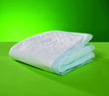Folded Lille Hygiene Mat disposable absorbent bed protector on green background