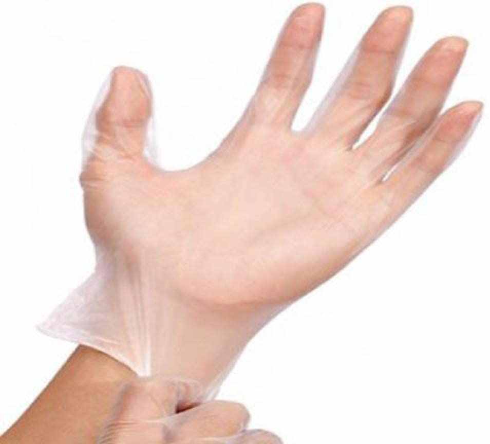 Hand wearing a transparent powder free vinyl glove for medical and household use
